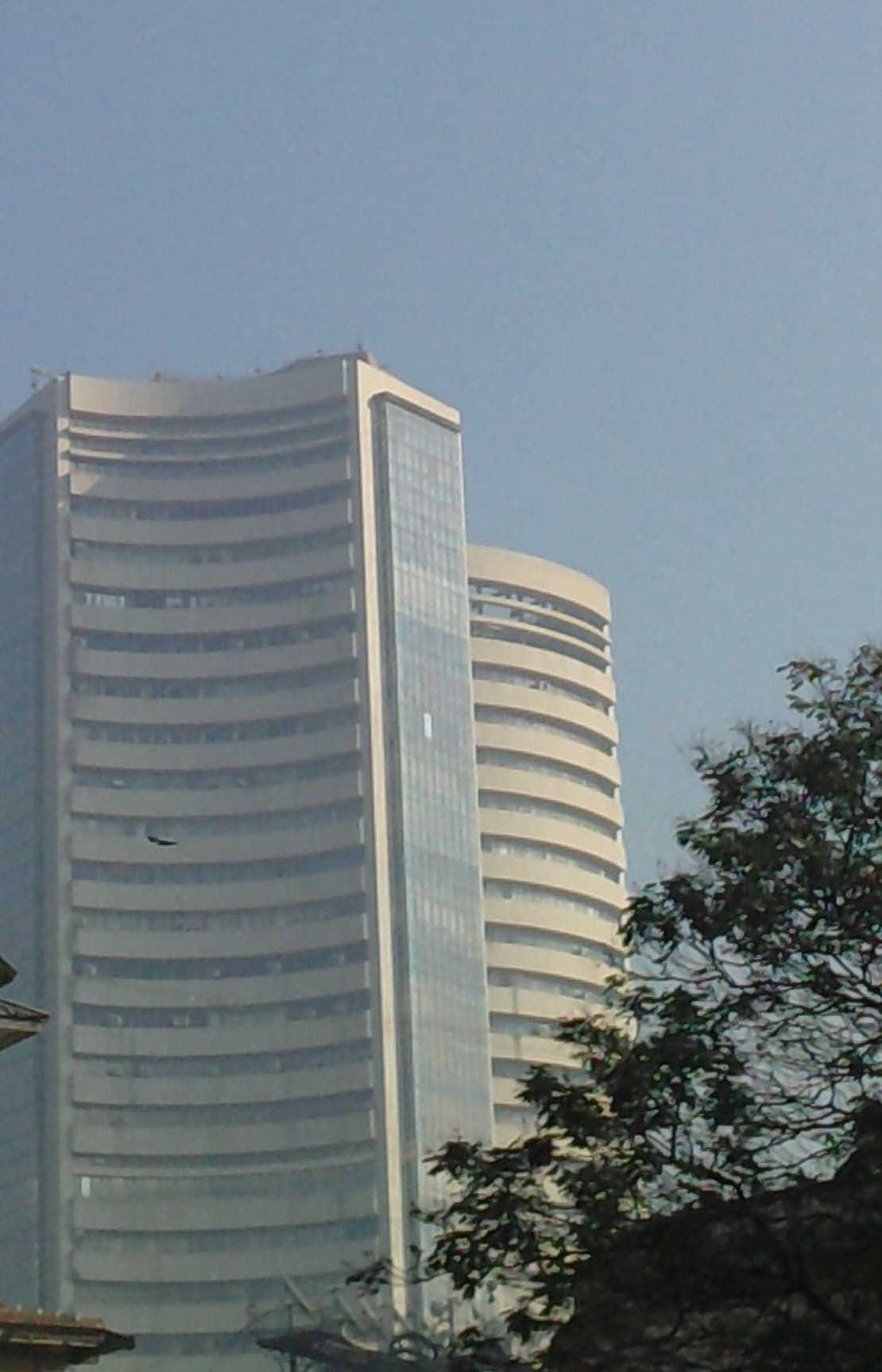 Sensex rises 308 points, Nifty above 23,000 even as broader markets crash